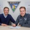 Lewis Martin re-signs