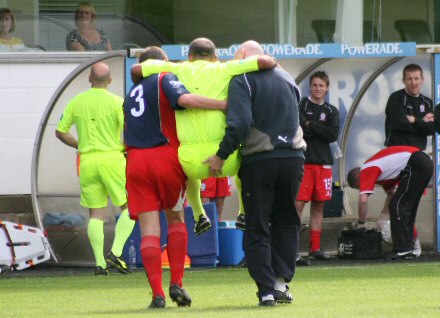 Anthony Law is carried off Anthony Law is carried off