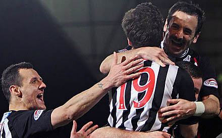 Pars players congratulate Liam Buchanan Pars players congratulate Liam Buchanan