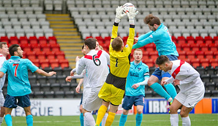 Callum Morris is beaten to the ball Callum Morris is beaten to the ball
