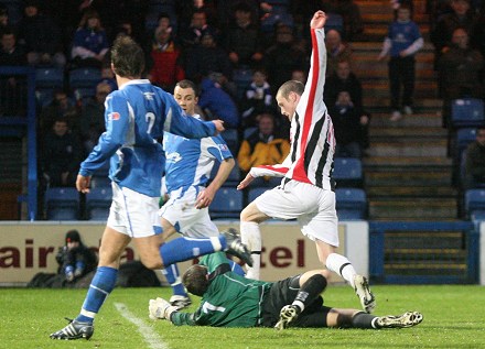 Andy Kirk tries to get through the Queens defence Andy Kirk tries to get through the Queens defence