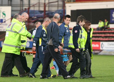 James McPake is carried off James McPake is carried off