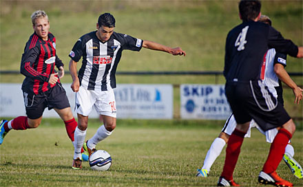 Fayssal El Bakhtaoui prepares to chip Steven Mayne