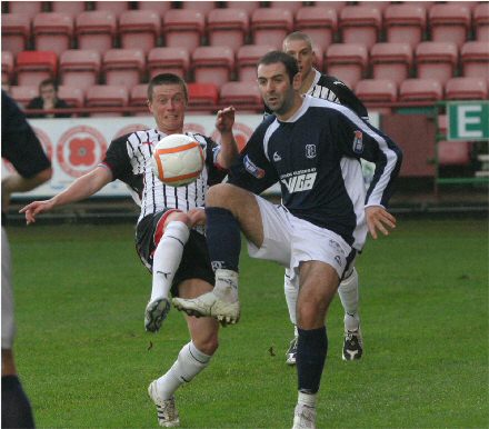Joe Cardle challenges for the ball v Dundee Joe Cardle challenges for the ball v Dundee