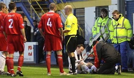 David Graham receiving treatment at Cappielow Park David Graham receiving treatment at Cappielow Park