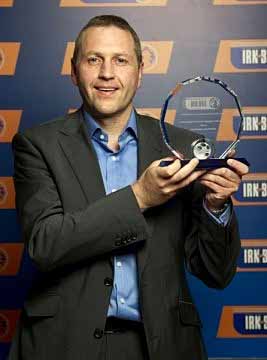 Bill Hodgins collects Jim McIntyre's award at the SFL Awards Ceremony