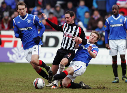 Mark Kerr is chopped down by Steven Davis Mark Kerr is chopped down by Steven Davis
