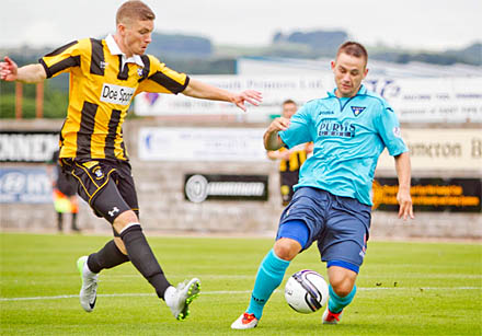 Pat Clarke takes down Ryan Wallace for penalty