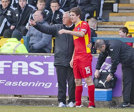 Grant Munro gets instruction before making his first team debut Grant Munro gets instruction before making his first team debut