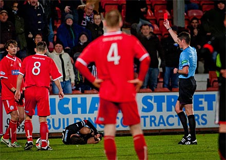 Des Roache shows Stuart Anderson a red card Des Roache shows Stuart Anderson a red card
