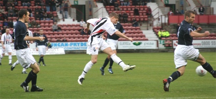 Calum Woods shoots at goal Calum Woods shoots at goal