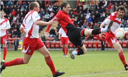 David Graham tries in vain to get on the end of a cross David Graham tries in vain to get on the end of a cross