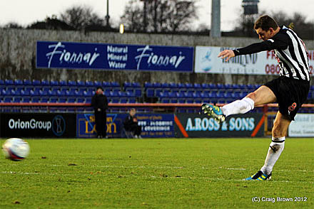 Martin Hardie belts in the free kick that led to Barrowman's goal Martin Hardie belts in the free kick that led to Barrowman's goal