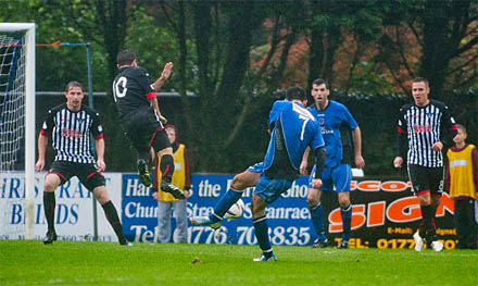 Steven Bell fires a shot on target