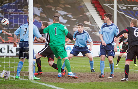 Andy Geggans effort is cleared off the line Andy Geggans effort is cleared off the line