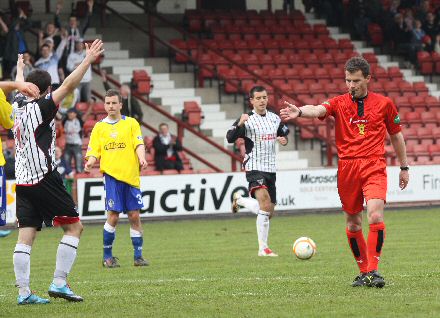 Referee Steve Conroy points to the penalty spot Referee Steve Conroy points to the penalty spot