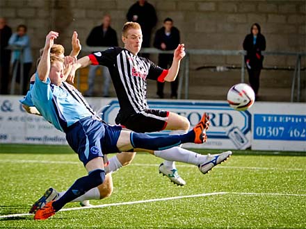 Andy Geggan tries to get on the end of a cross Andy Geggan tries to get on the end of a cross