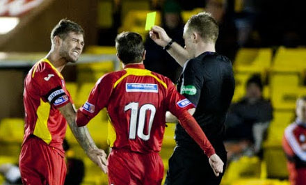 Jordan McMillan picks up a yellow card Jordan McMillan picks up a yellow card
