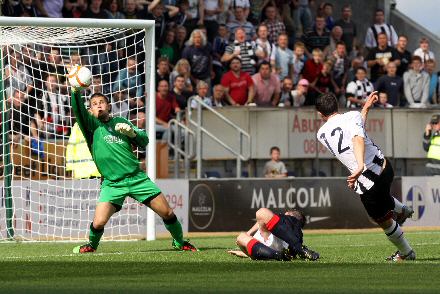 Steven McDougalls shot is saved by Falkirk keeper Bobby Olejnik Steven McDougalls shot is saved by Falkirk keeper Bobby Olejnik