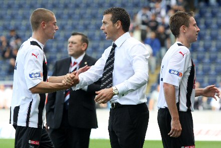 Jim McIntyre congratulates his players as they leave the field at the Falkirk Stadium Jim McIntyre congratulates his players as they leave the field at the Falkirk Stadium