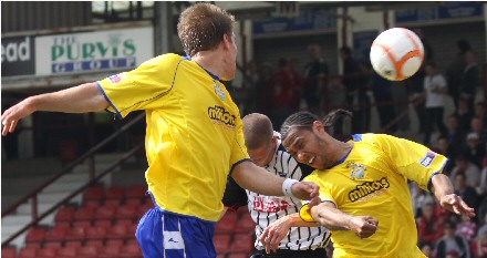 Calum Woods attempts to score at corner kick Calum Woods attempts to score at corner kick