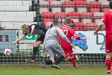 Jonathan Page clears off the line Jonathan Page clears off the line
