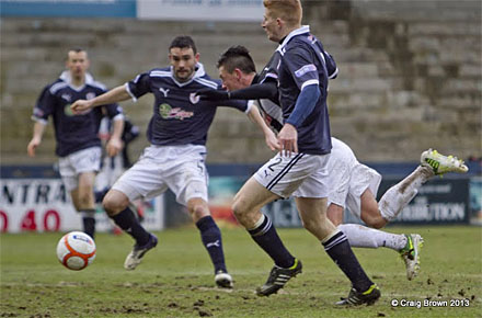 Jason Thomson barges over Joe Cardle Jason Thomson barges over Joe Cardle