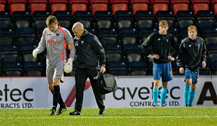 Ryan Scully is assisted off by physio Kenny Murray Ryan Scully is assisted off by physio Kenny Murray