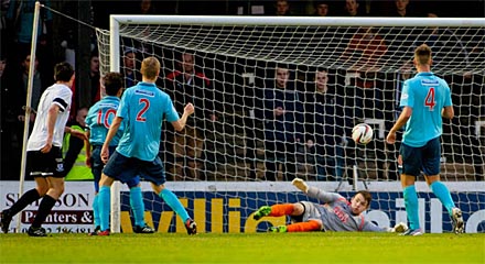 A shot from Michael Donald is stopped by Ryan Scully