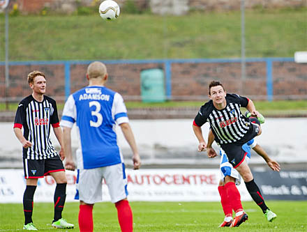 Callum Morris heads in 