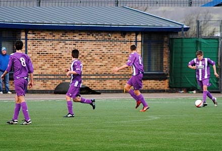 Steven Leslie shoots in the winner as his team mates queue up Steven Leslie shoots in the winner as his team mates queue up