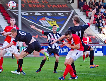 Andy Geggan is pushed over in the box Andy Geggan is pushed over in the box