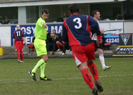 Referee Alan Muir points to the spot Referee Alan Muir points to the spot