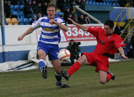 Gary Mason puts in a tackle v Morton Gary Mason puts in a tackle v Morton
